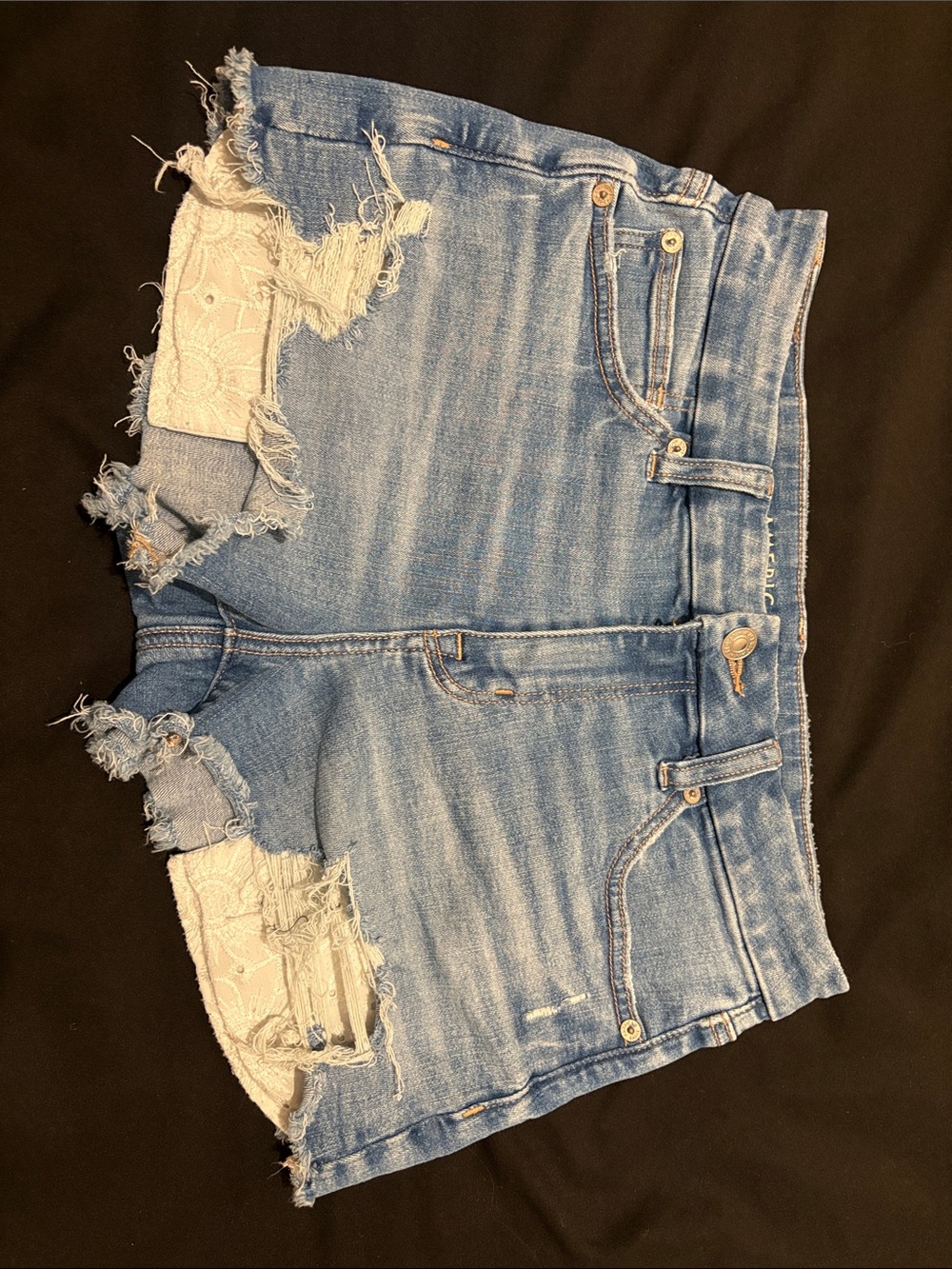 American Eagle Outfitters distressed blue denim shorts